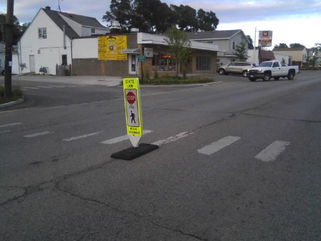 An enhanced marked crosswalk in downtown Round Lake Heights, helping to make sure that everyone knows a full stop is required when the crosswalk is in use. 